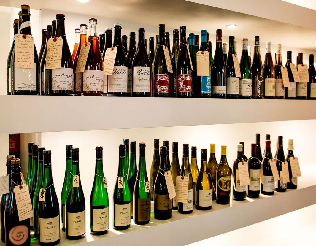 Henry-And-Sons-Shop-Interior-Bottles-White-Shelves