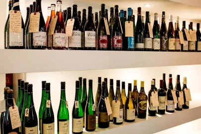 Henry-And-Sons-Shop-Interior-Bottles-White-Shelves