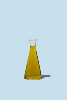Olive oil and blue background 